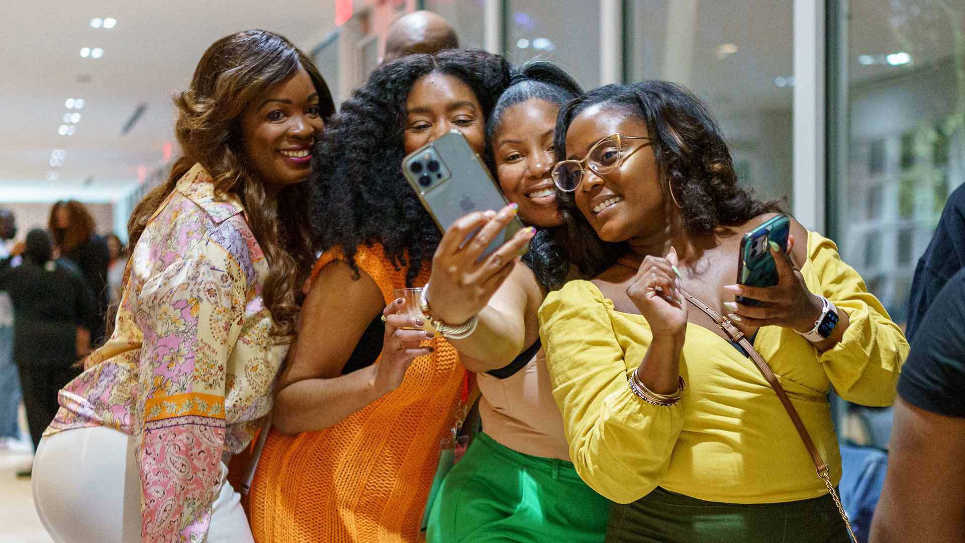 Tima Hawes '06, Andrea Jackson '08, Ja-Nee Jackson '06 and Shiron Lindsay '09 take a selfie.