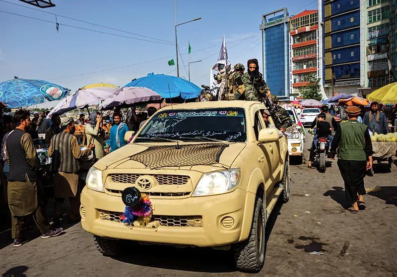 A Taliban patrol rolls through Kabul