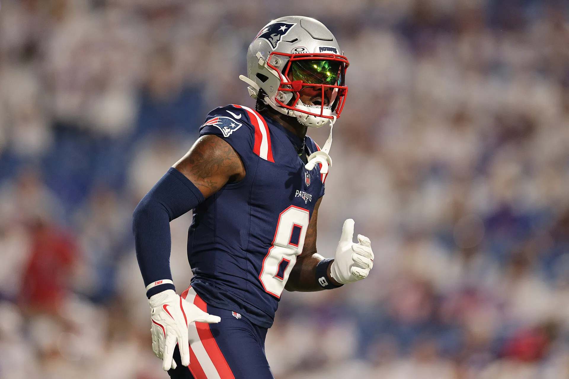 Stefon Diggs in a Patriots uniform and helmet