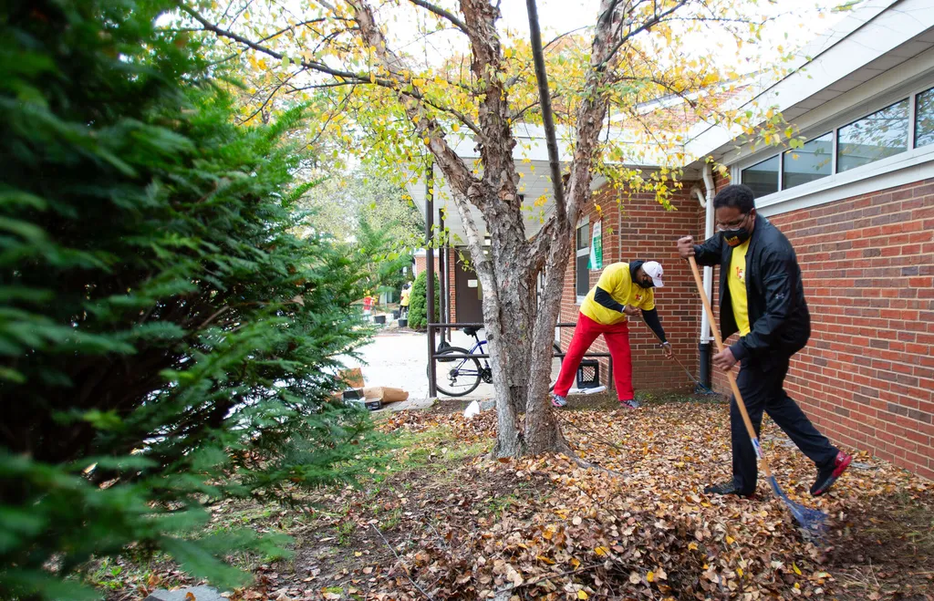 President Pines rakes leaves at local high school