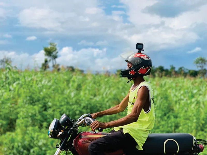 person rides motorcycle with camera on helmet