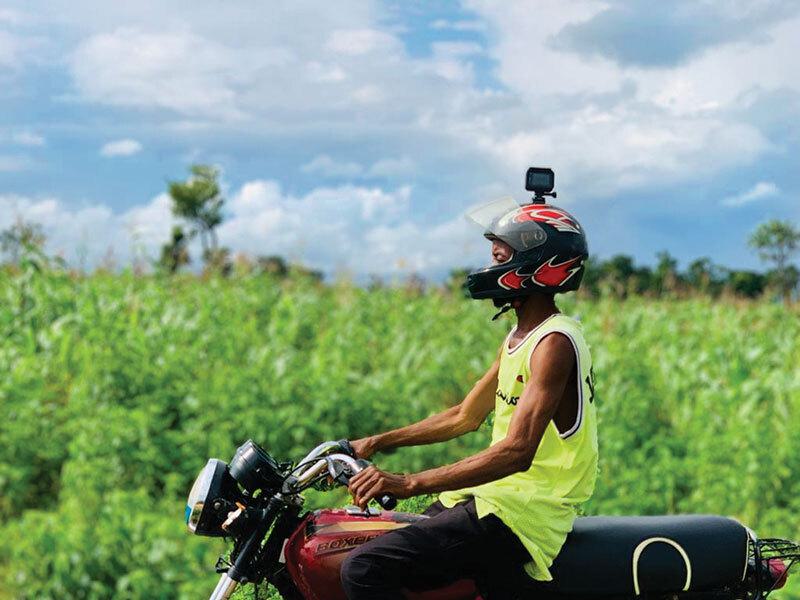 person rides motorcycle with camera on helmet