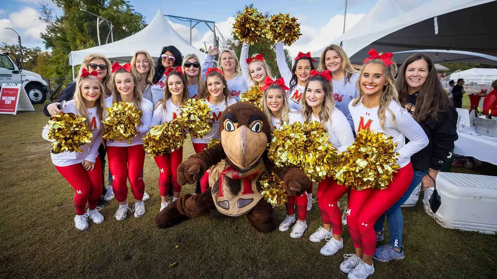 Cheerleaders pose with Testudo