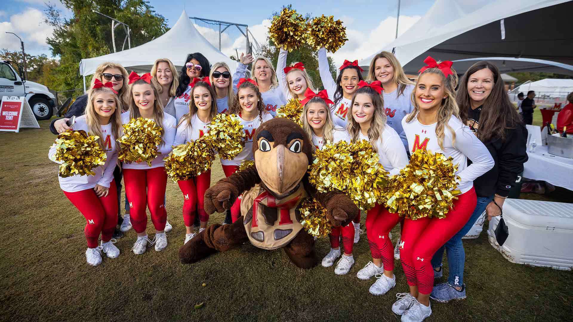 Cheerleaders pose with Testudo