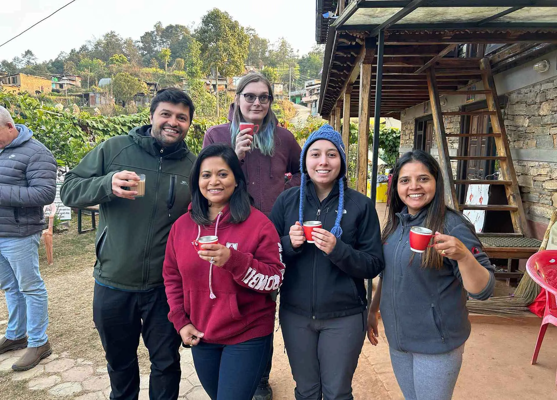 five people drinking tea