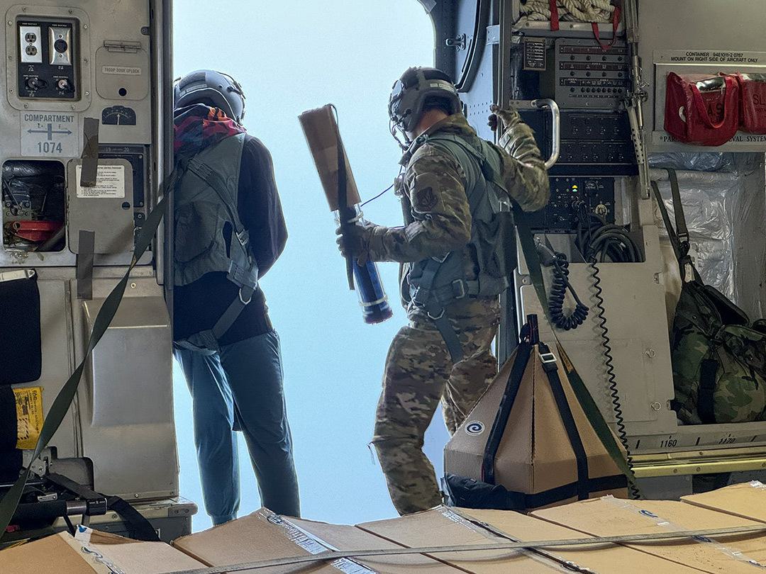 Guys look out an airplane door