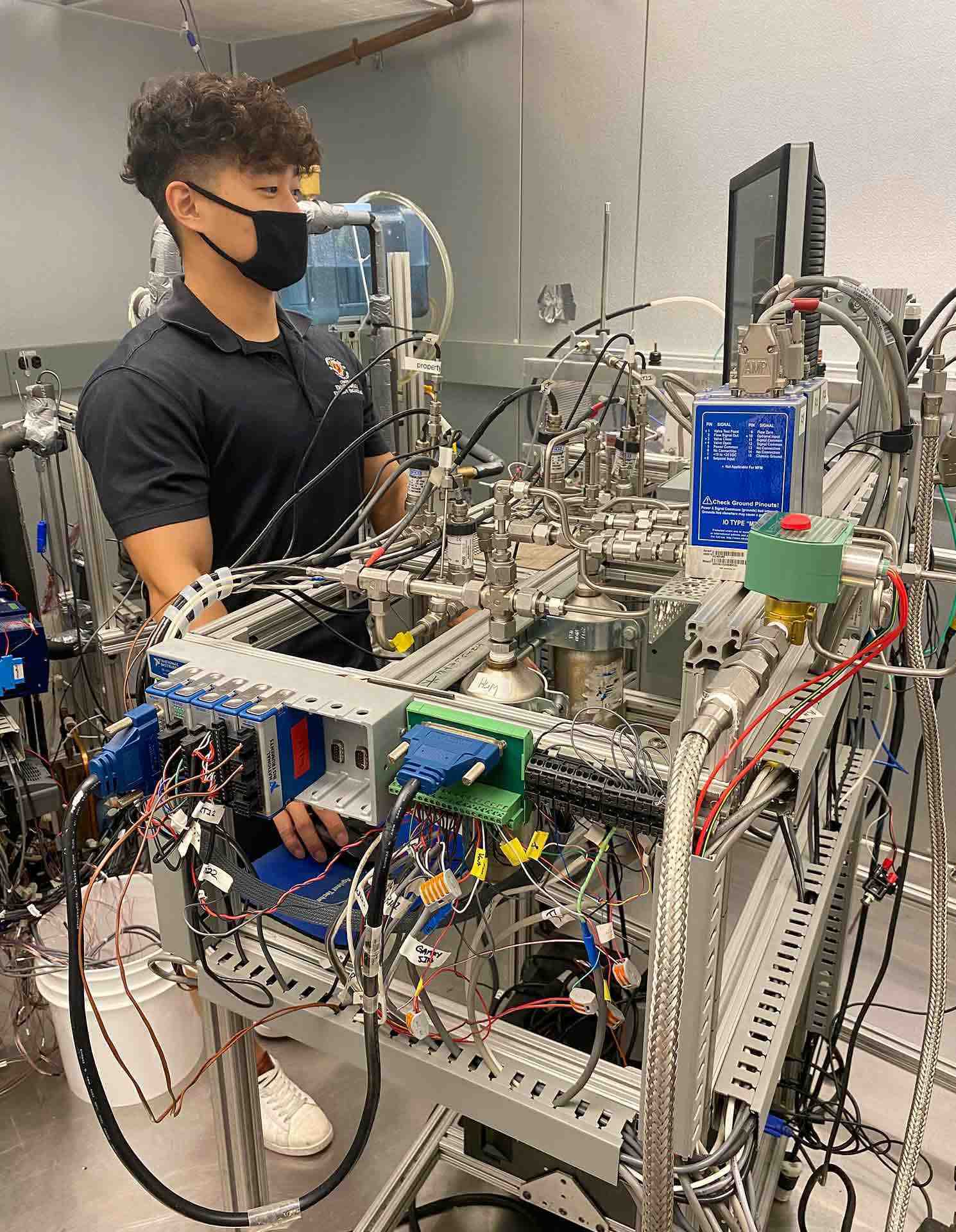person wearing mask works in lab