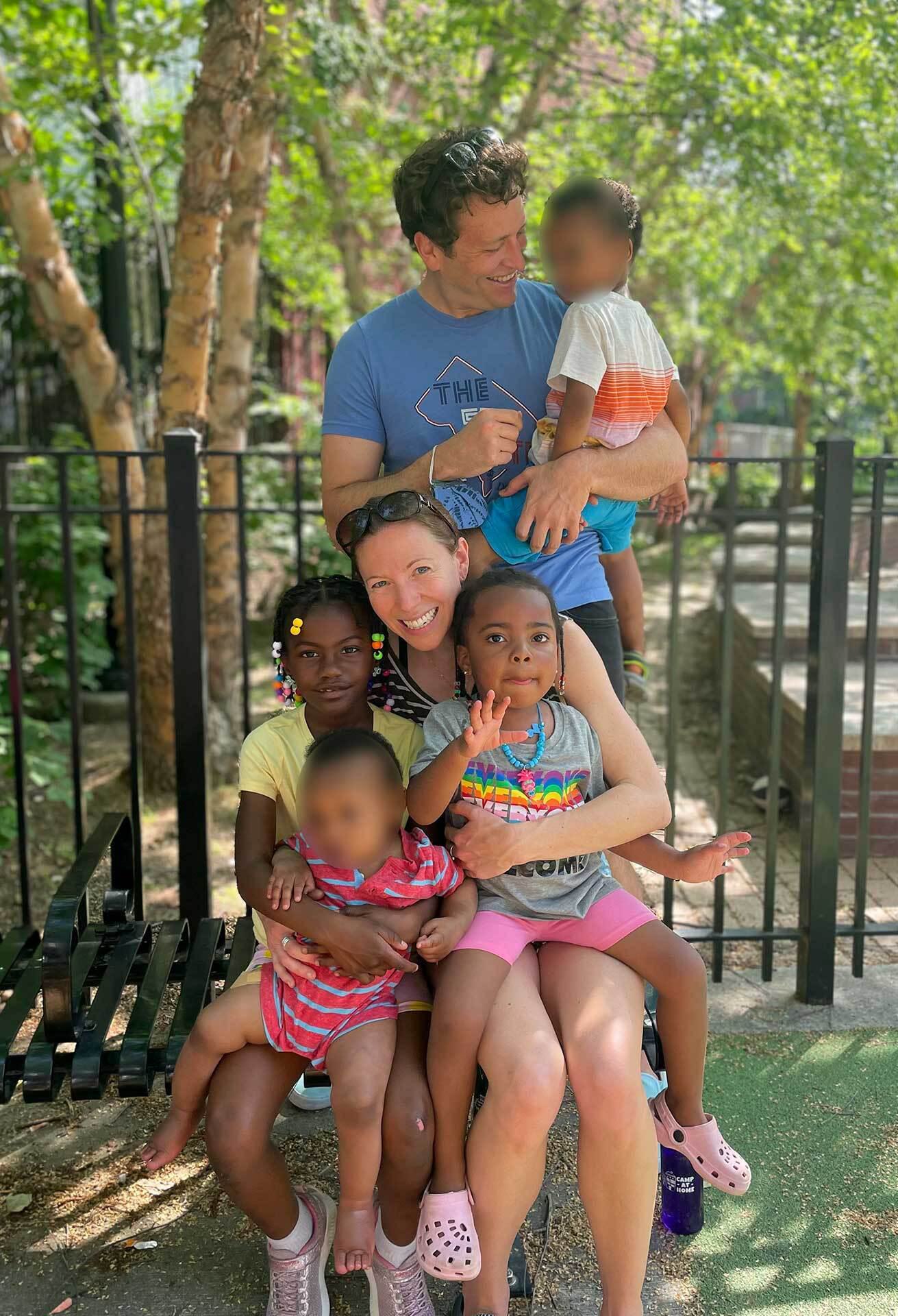 The Woodmans holding their four children in a family portrait