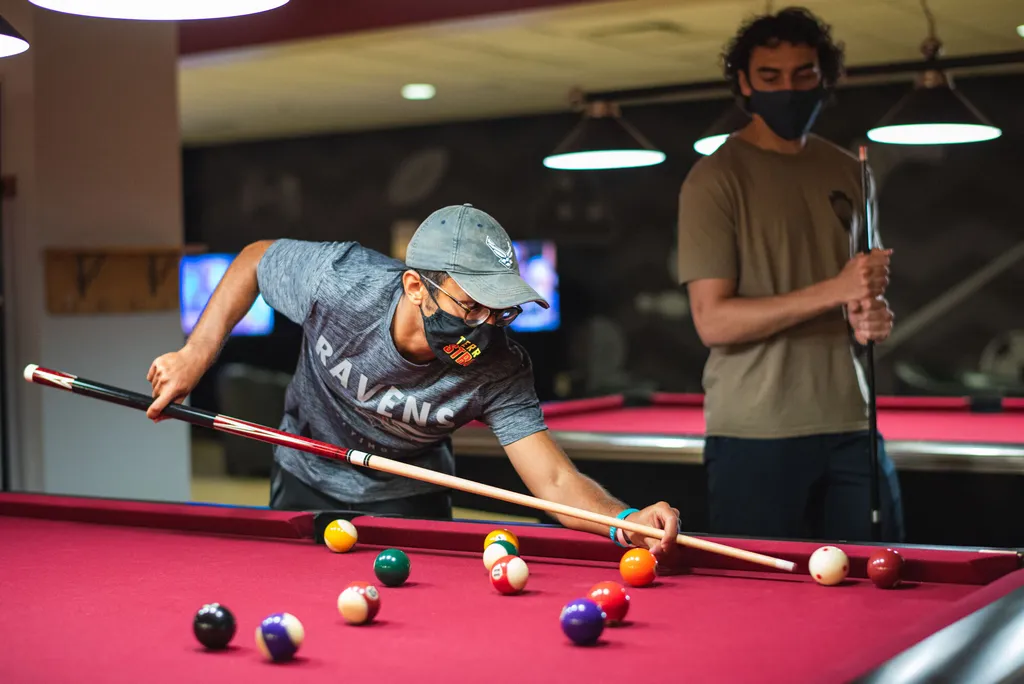 Students shoot pool