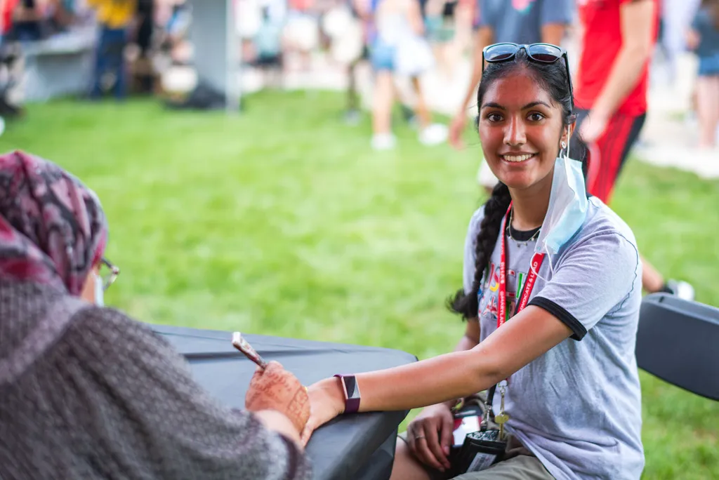 Student gets henna tattoo