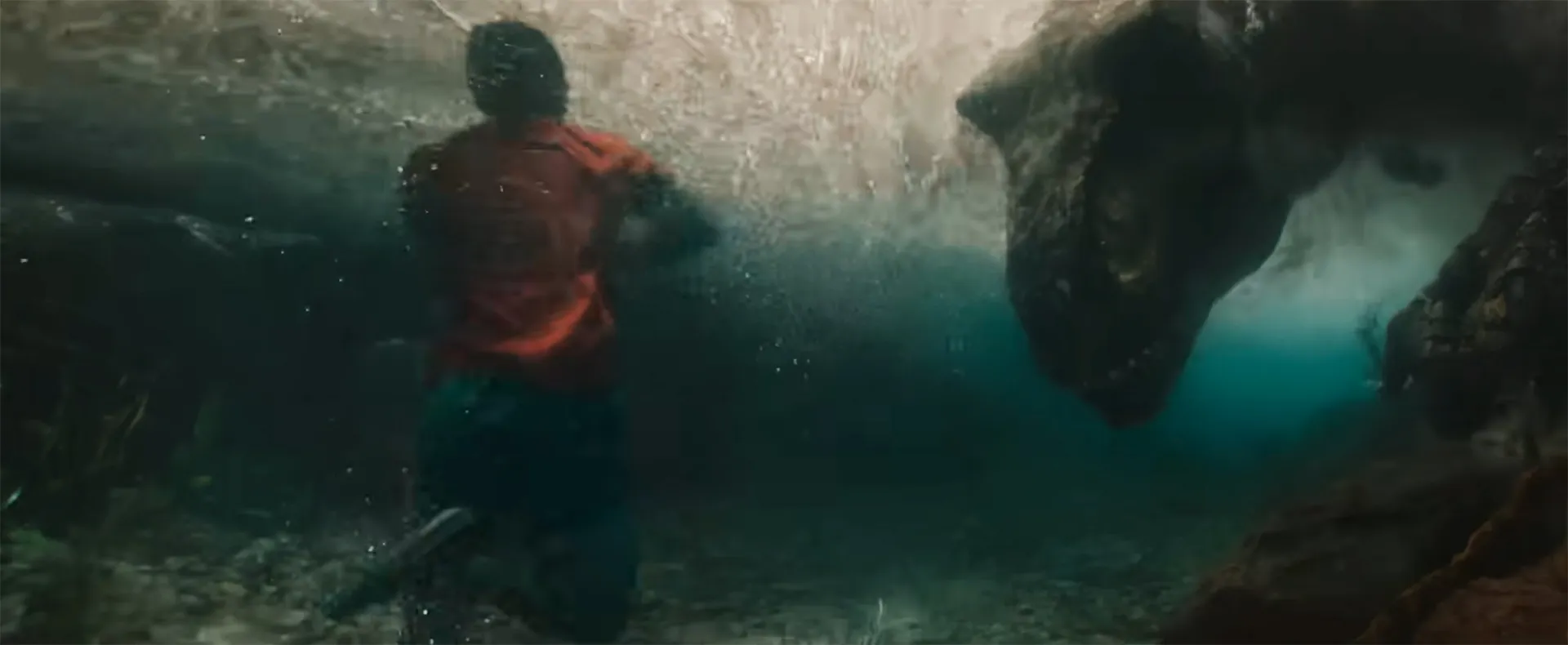 T. rex in a river chasing a person