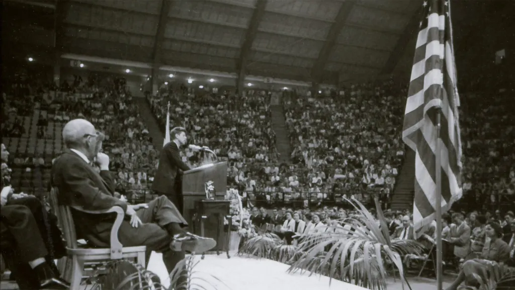Kennedy speaks on stage