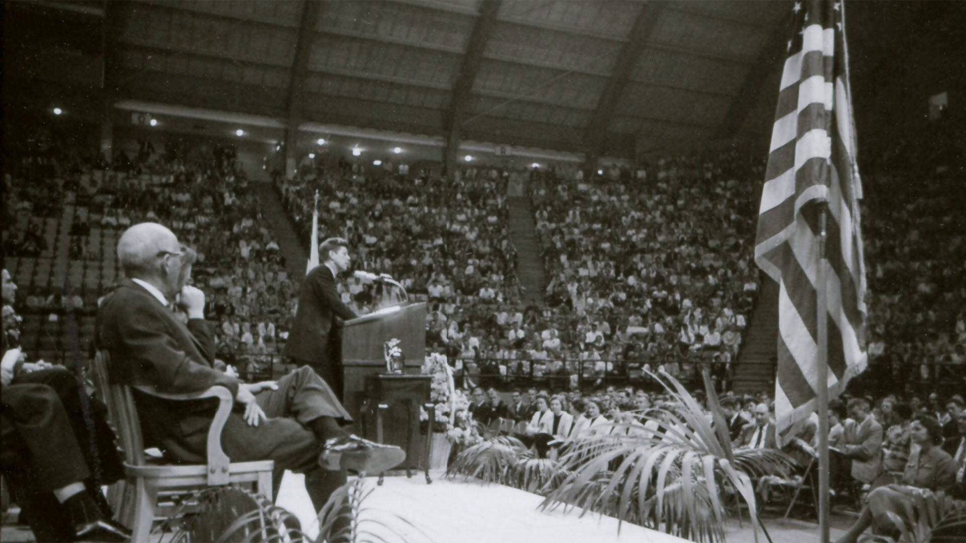 Kennedy speaks on stage