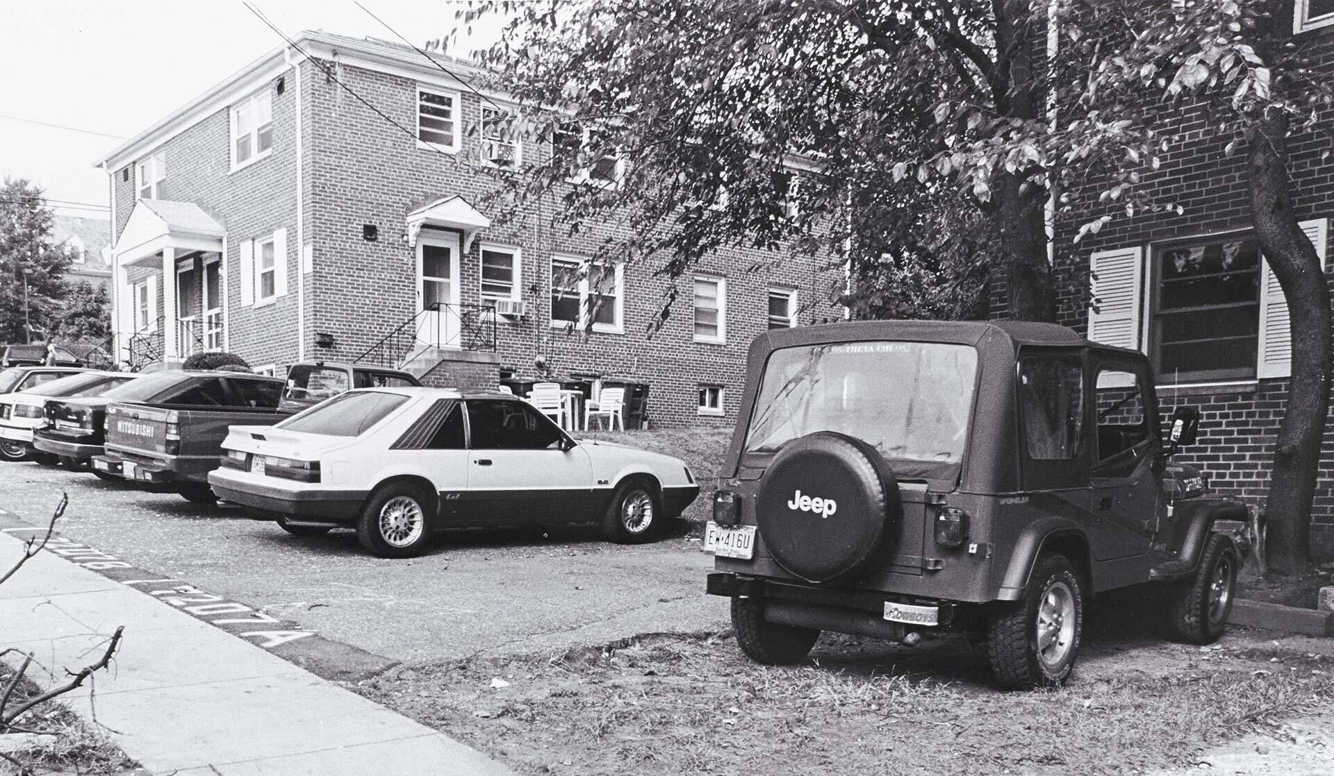 archival photo of cars parked outside a Knox Box