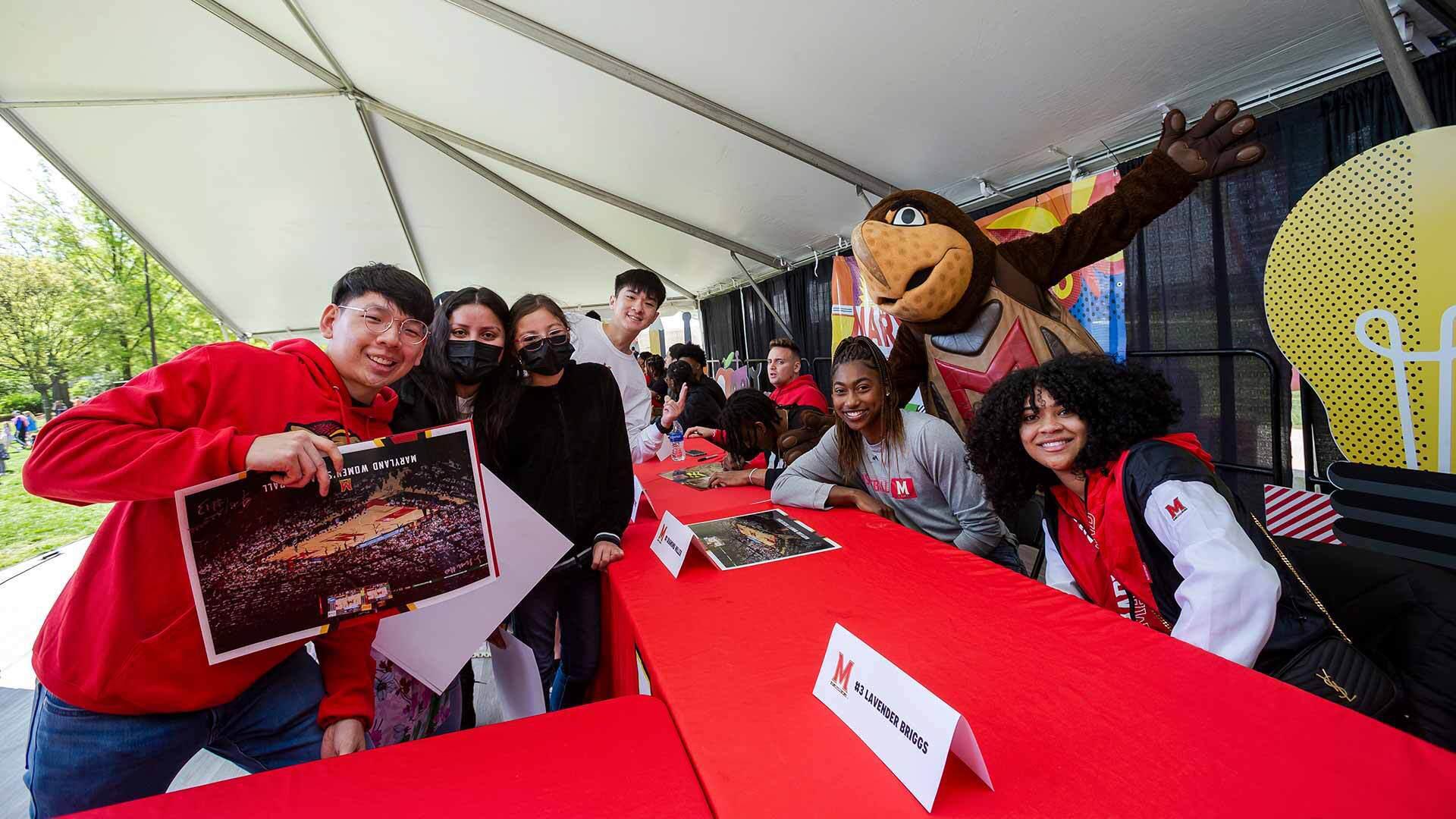 Maryland women's basketball players sign autographs
