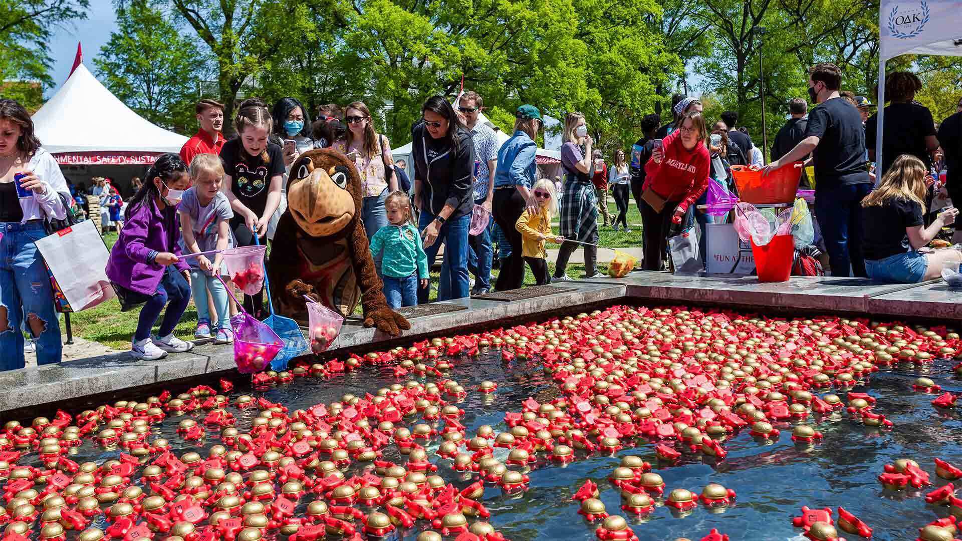 Kids fish for colorful terrapins in the ODK Fountain