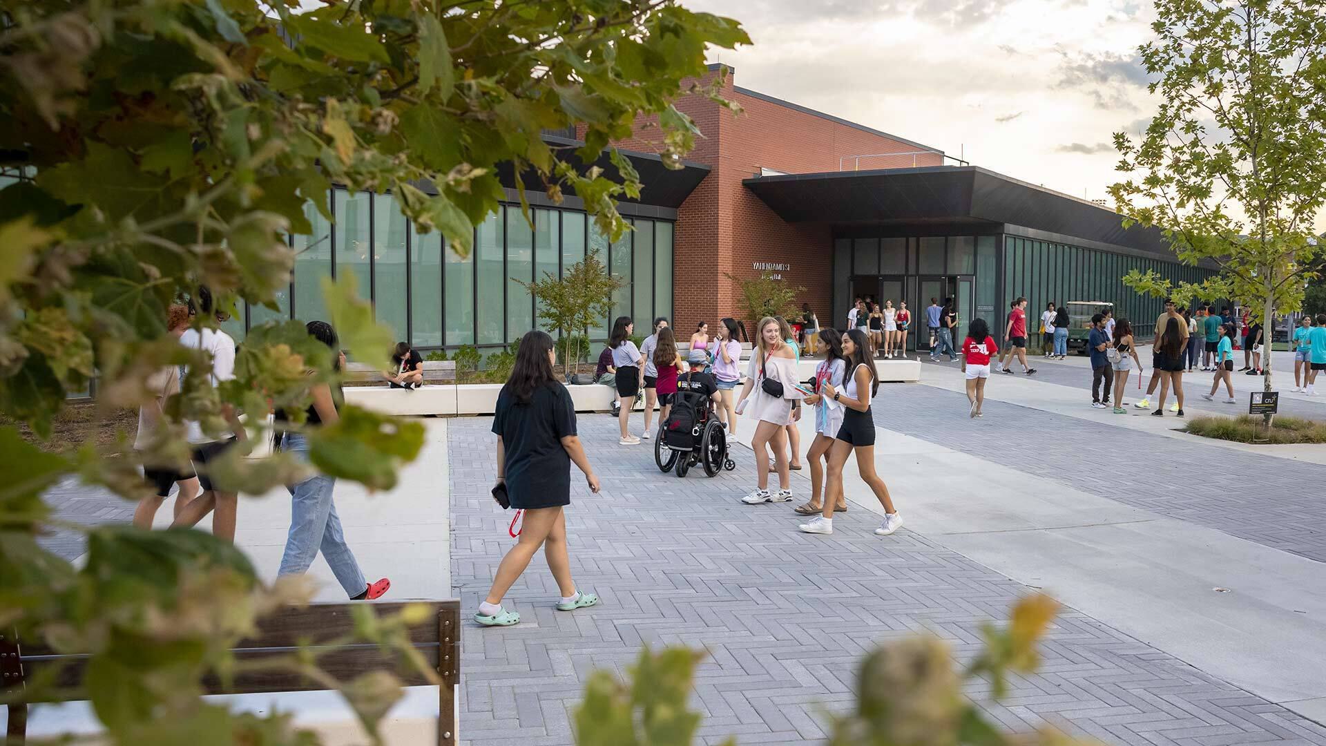 students walk in heritage plaza