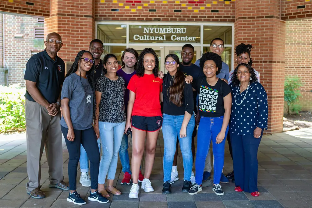students pose outside Nyumburu Cultural Center