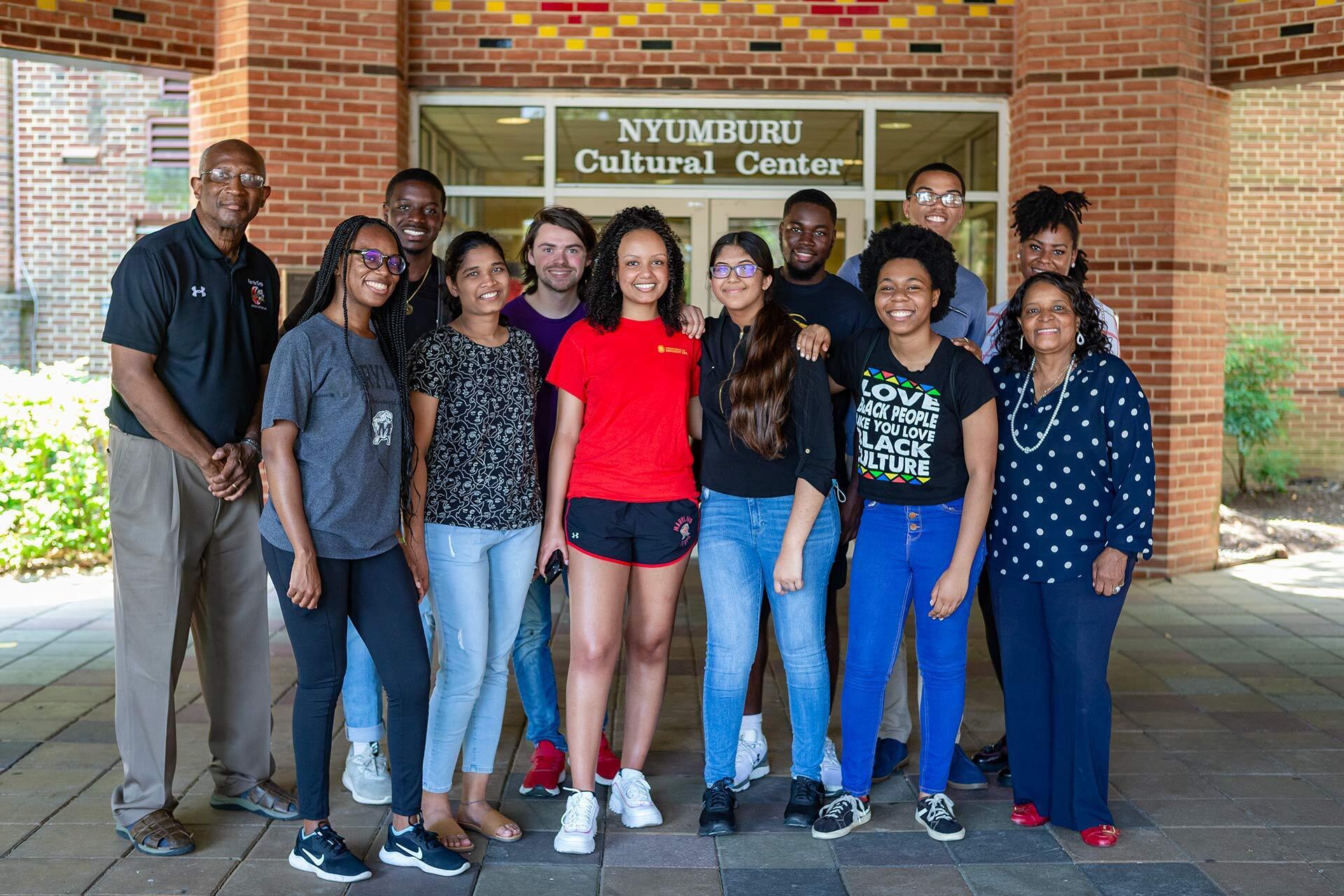students pose outside Nyumburu Cultural Center