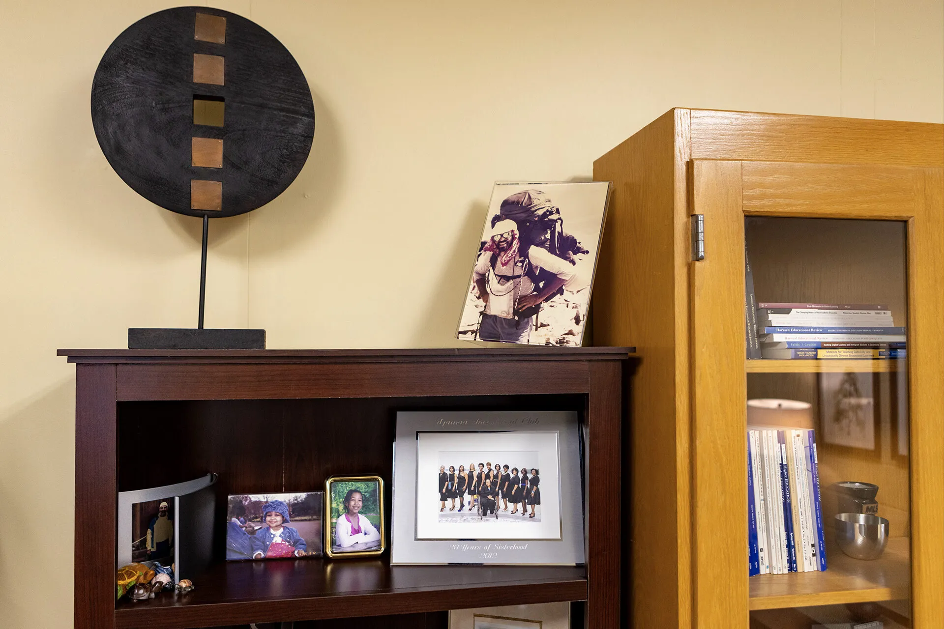 photo of Ned Britt hiking, with other photos on shelf