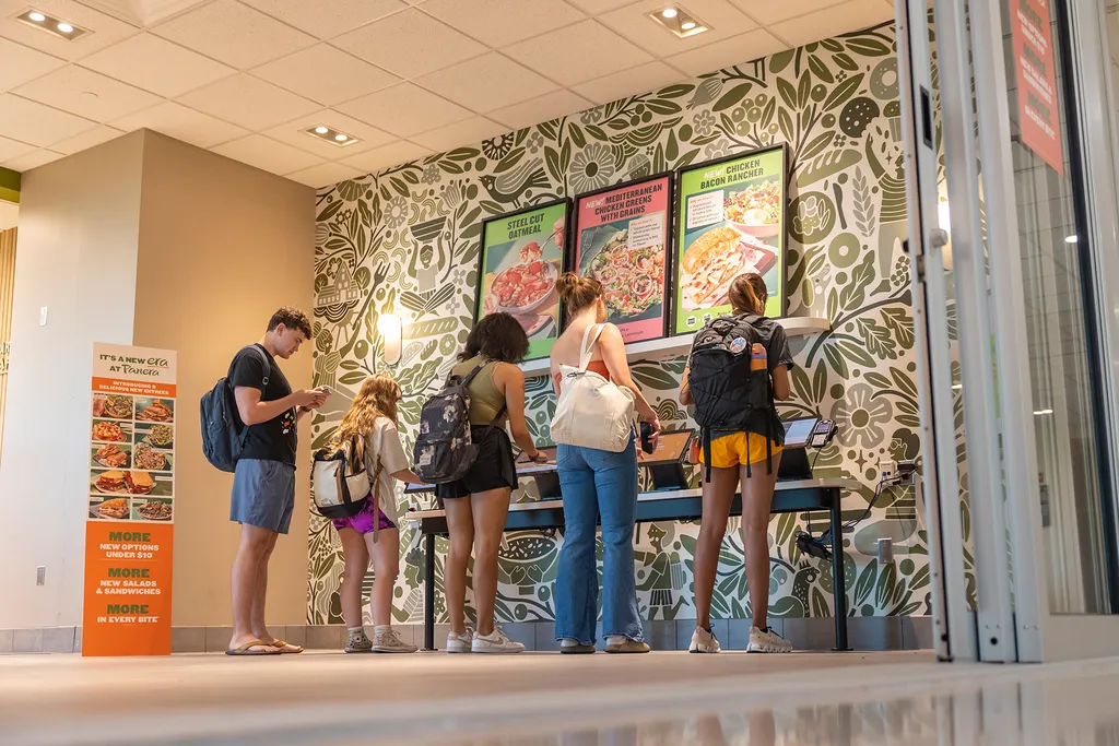 students order at kiosks at Panera