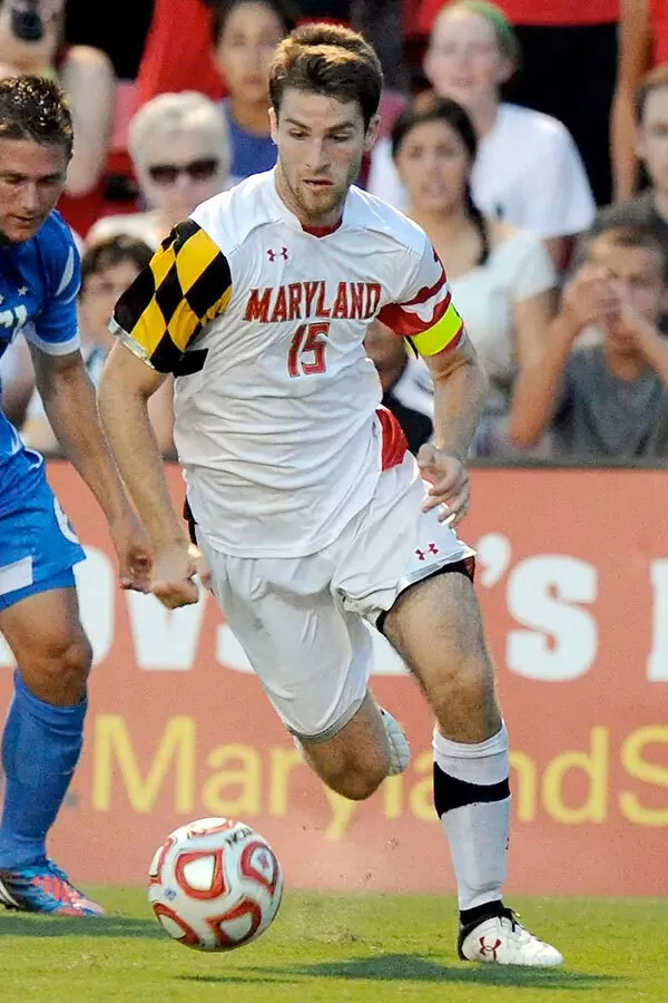 Patrick Mullins kicks soccer ball