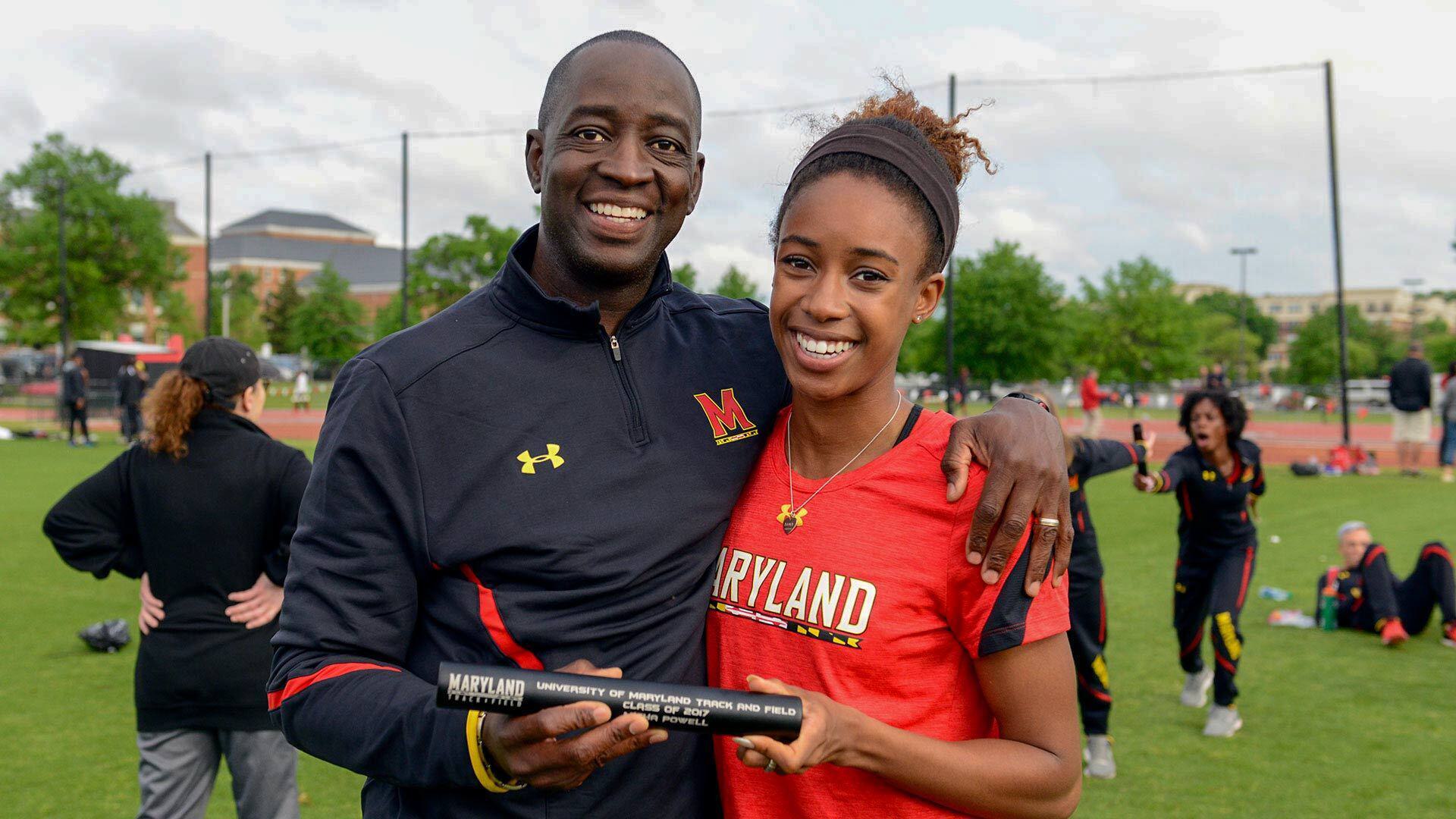 Andrew Valmon with a UMD student athlete