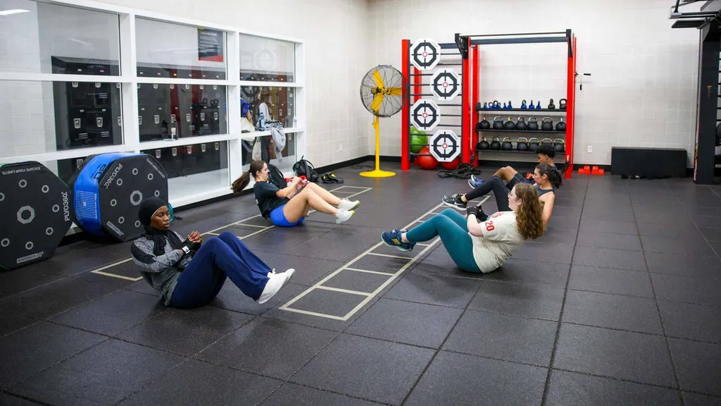 students exercise in fitness class
