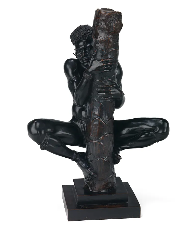 sculpture of man climbing tree