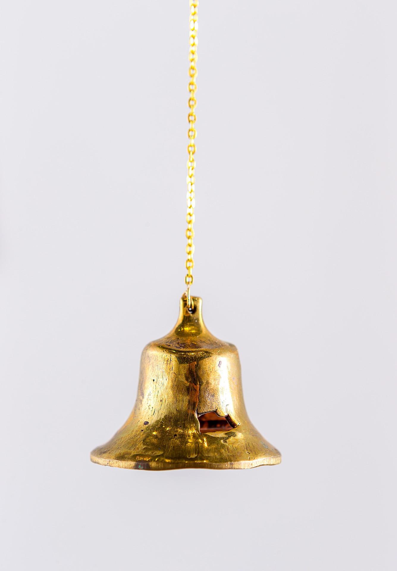 bell cast from melted bullet casings
