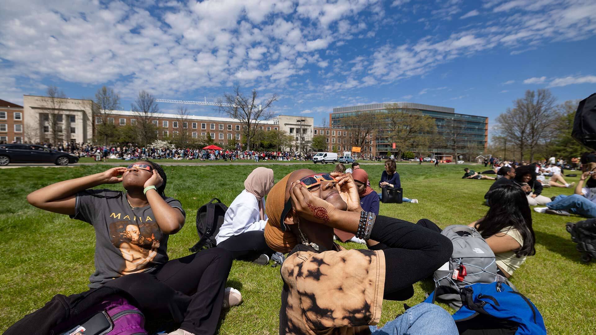 students watch eclipse