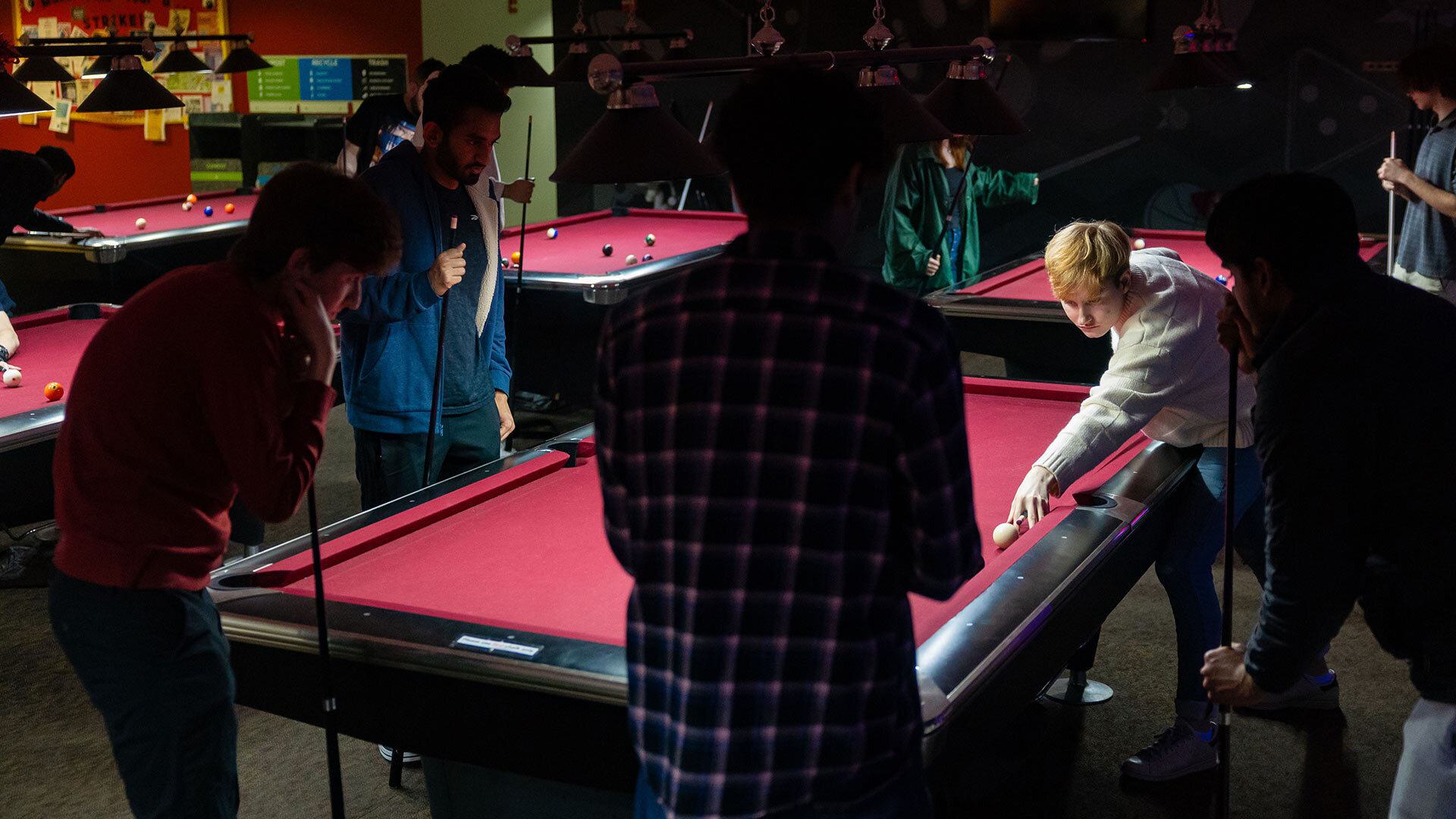 Students play billiards in TerpZone