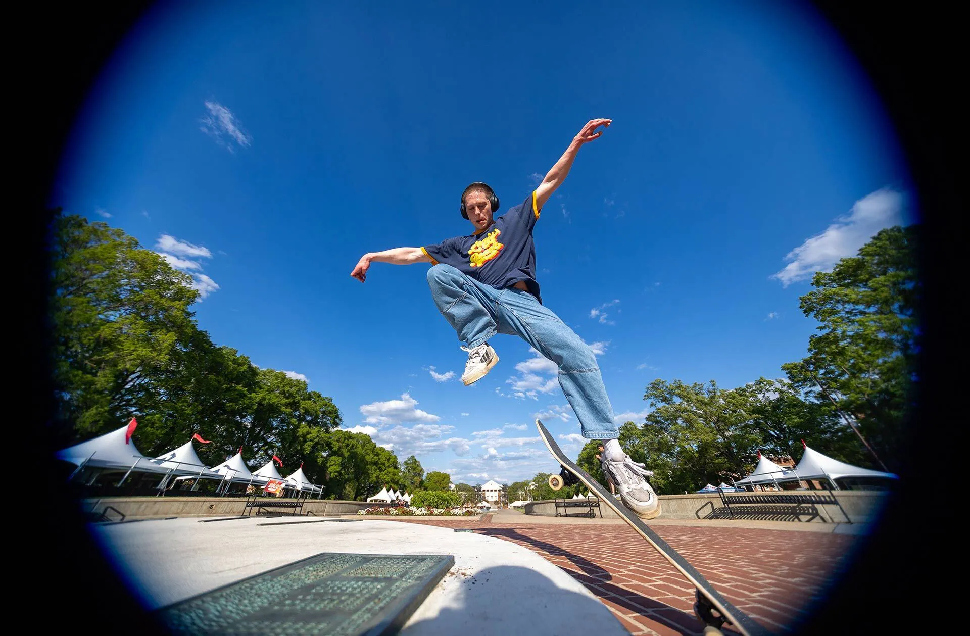 Student jumping off a skateboard