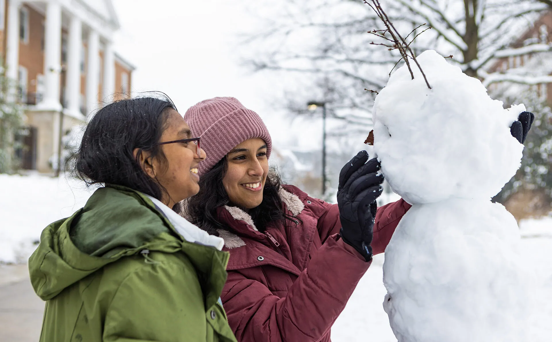 two students make a snowman