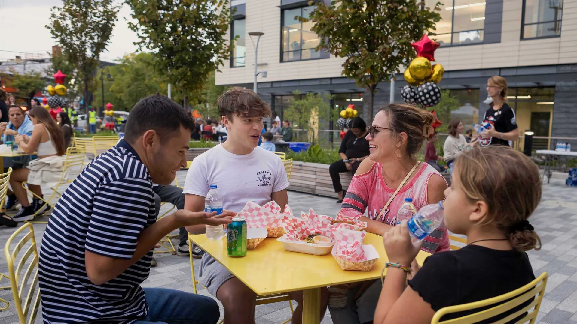 family eats treats outside city hall