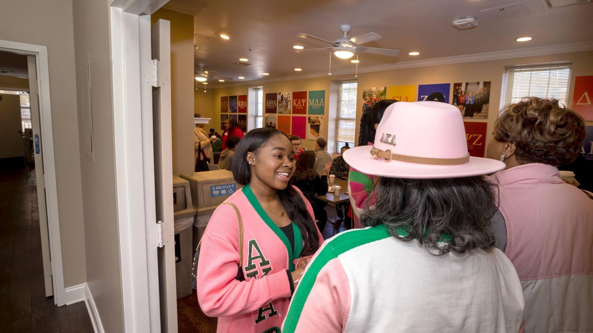 Alpha Kappa Alpha members talk in the Agora