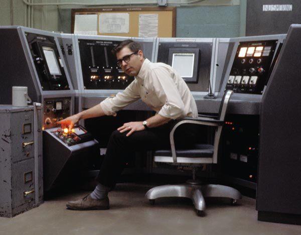 operator mans controls of nuclear reactor