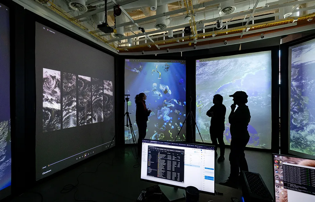 silhouettes of students with images of ocean and space
