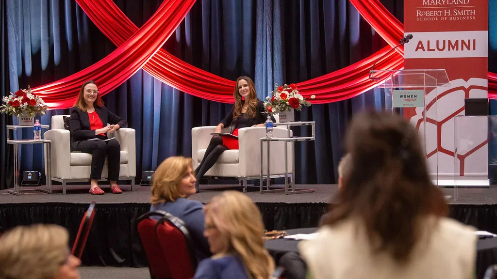 Janice deGarmo MBA ’07 speaks with moderator onstage at Women Inspire event