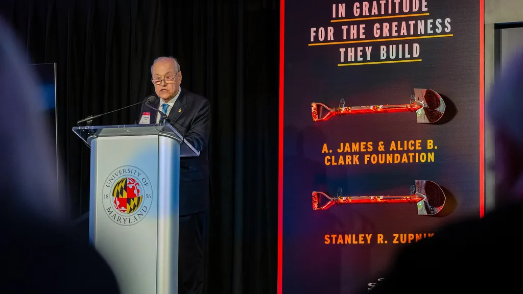 Zupnik speaks at podium