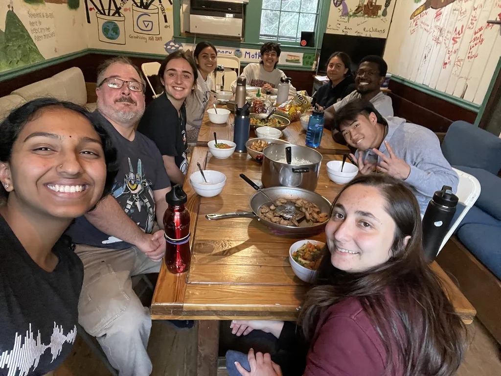 students on Alternative Break eat dinner together