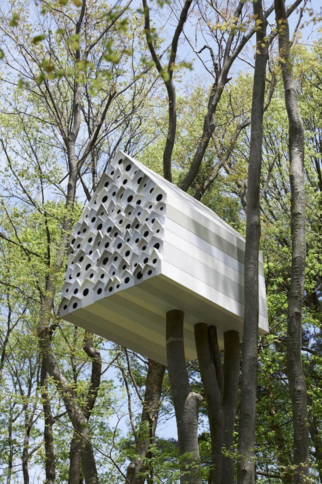 giant birdhouse with many holes