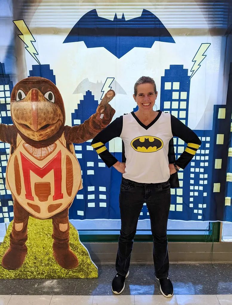 Shannon Browne as Batman next to Testudo