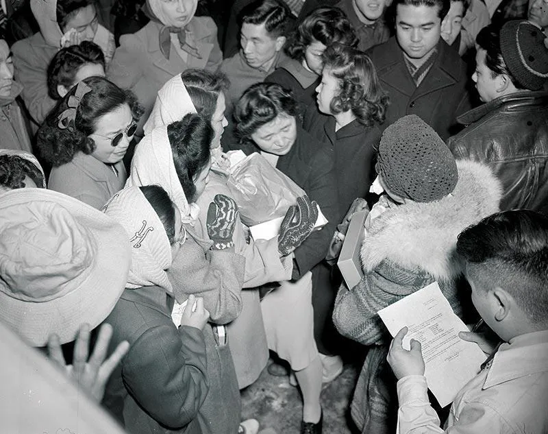 Prisoners in the Tule Lake Relocation Center in California say goodbye to people being transferred and granted leave