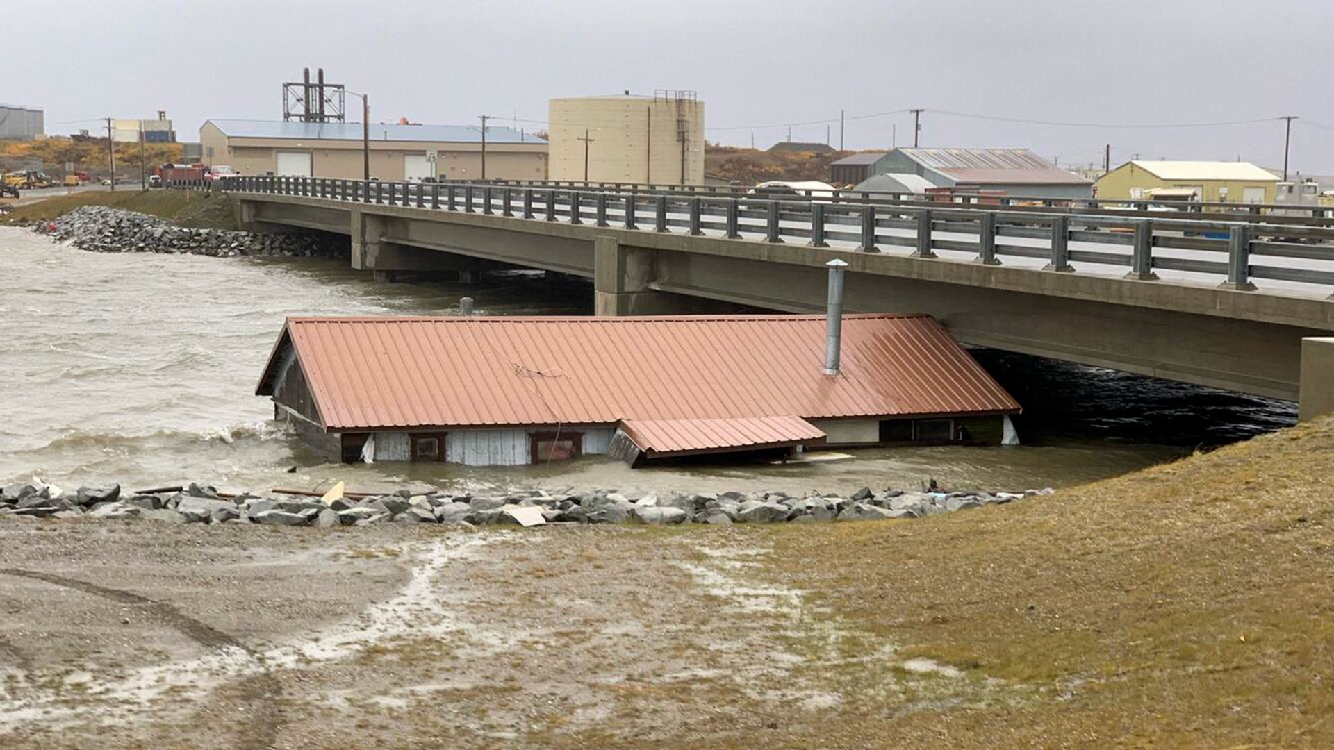 floodwater lifts building from foundation