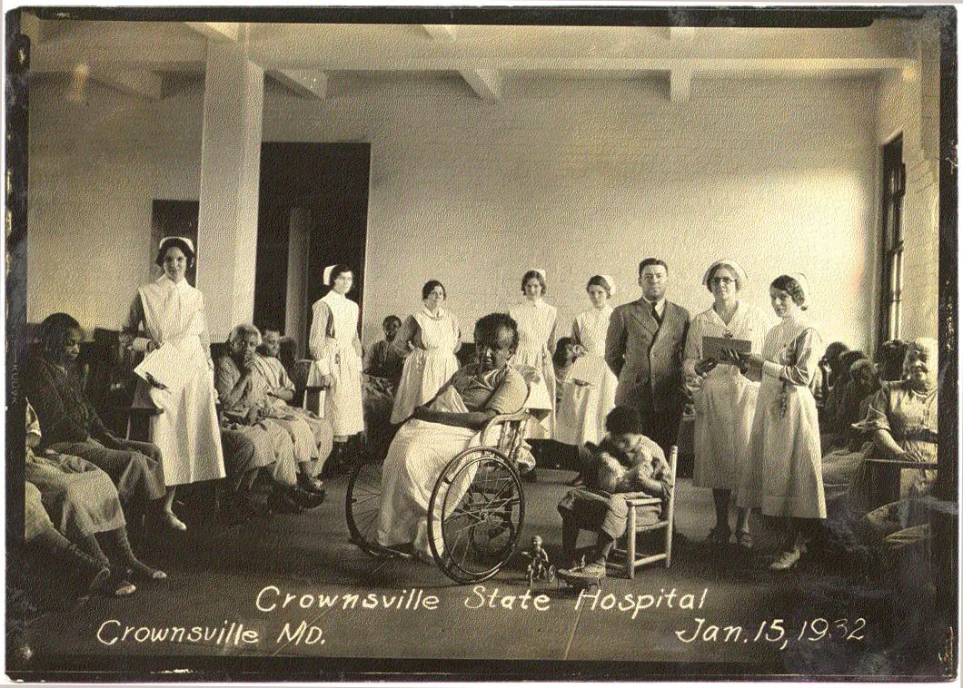 Hospital staff pose with patients