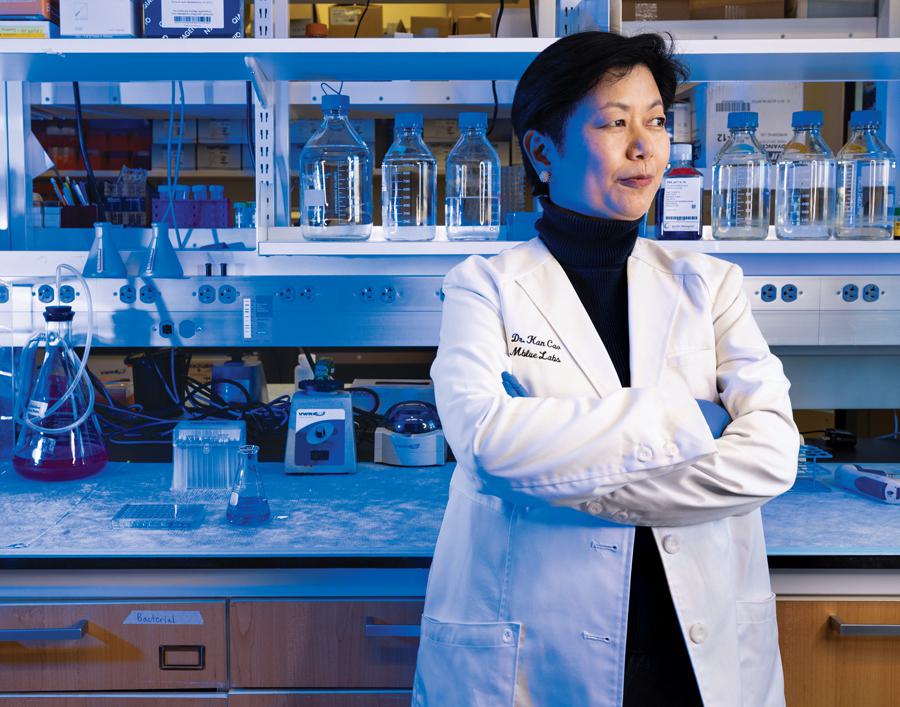 Kan Cao poses in lab