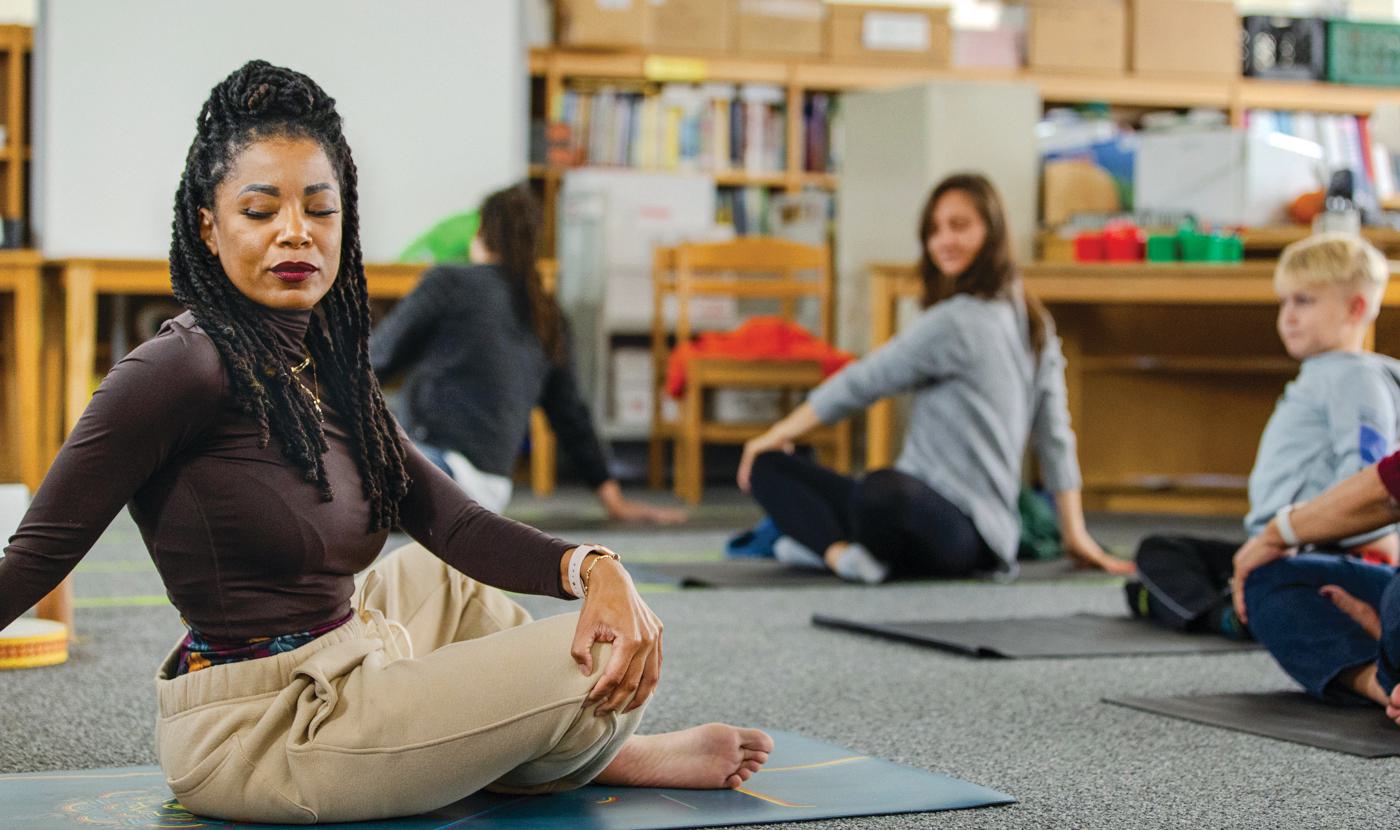 woman leads yoga session