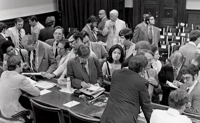 Connie Chung among crowd of white men