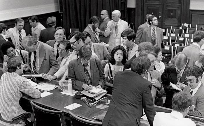 Connie Chung among crowd of white men